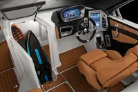 Manufacturer Provided Image: 2020 MasterCraft X26 boat interior with modern dashboard and surfboard storage.