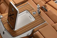 Manufacturer Provided Image: 2020 MasterCraft X26 boat interior with open storage compartment and luxurious seating.