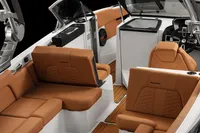 Manufacturer Provided Image: 2020 MasterCraft X26 boat interior with tan leather seats and modern design.
