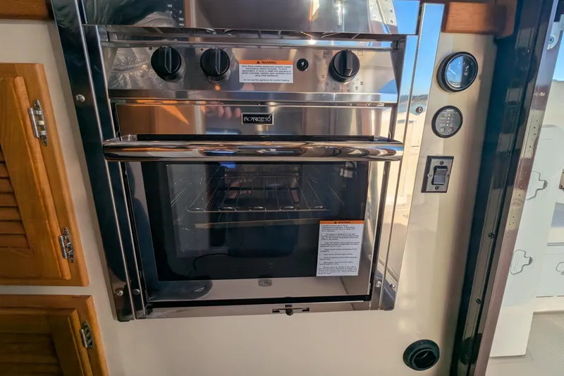 Lone Star Yacht Photos Pics Stainless steel oven in 2022 Ranger Tugs R-31 S boat interior.