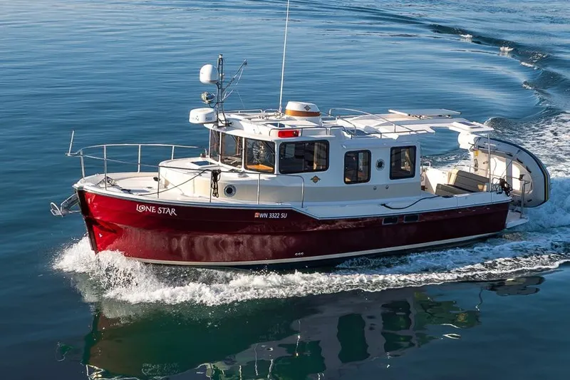 Lone Star Yacht Photos Pics 2022 Ranger Tugs R-31 S cruising on calm blue water.