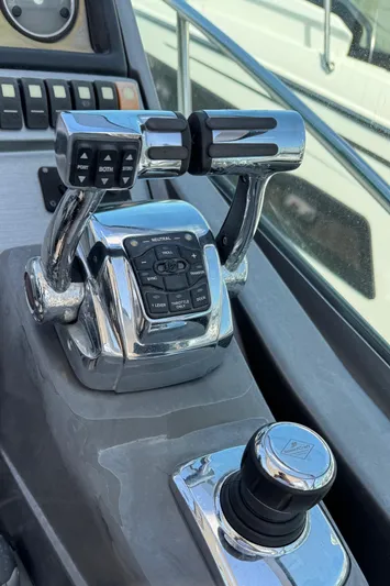  Yacht Photos Pics Close-up of 2013 Monterey 320 Sport Yacht controls and throttle levers.
