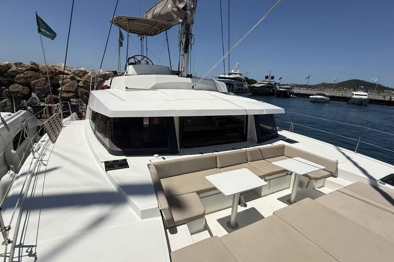 Raf IV Yacht Photos Pics 2020 Bali 4.3 catamaran with spacious deck and seating, docked at a marina.