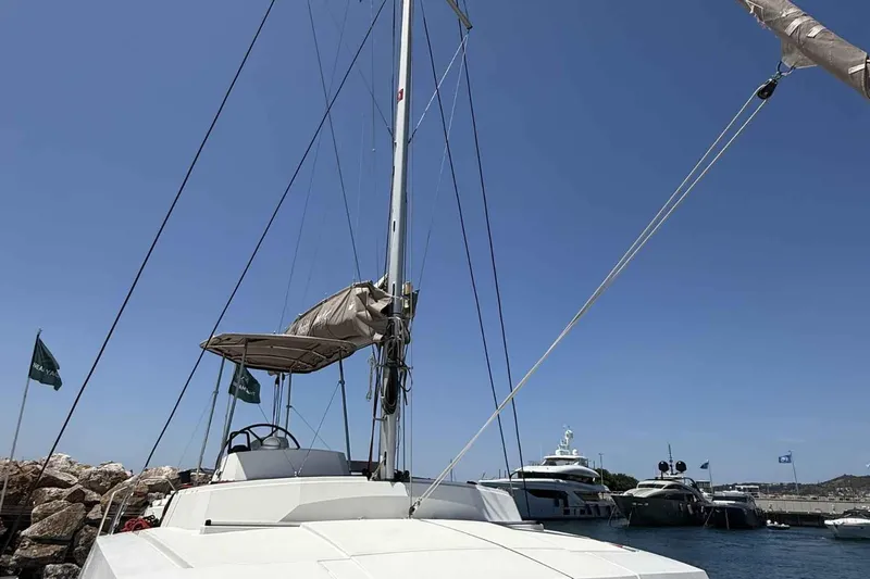 Raf IV Yacht Photos Pics 2020 Bali 4.3 catamaran docked at marina under clear blue sky.