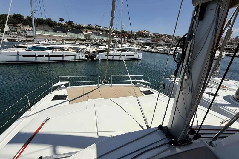 Raf IV Yacht Photos Pics 2020 Bali 4.3 catamaran docked in a marina, surrounded by other boats.