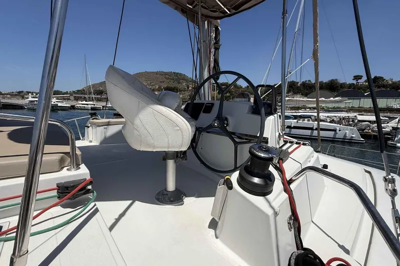 Raf IV Yacht Photos Pics Helm of 2020 Bali 4.3 catamaran in marina, featuring steering wheel and seating.