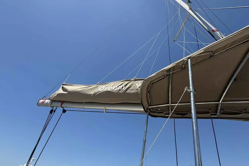 Raf IV Yacht Photos Pics Sailboat mast and boom of 2020 Bali 4.3 against clear blue sky.