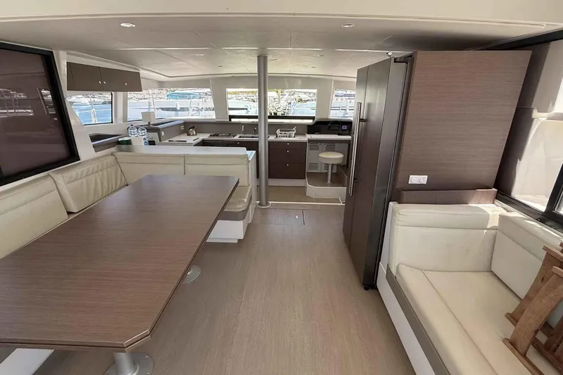 Raf IV Yacht Photos Pics Luxurious interior of a 2020 Bali 4.3 catamaran with modern kitchen and seating area.