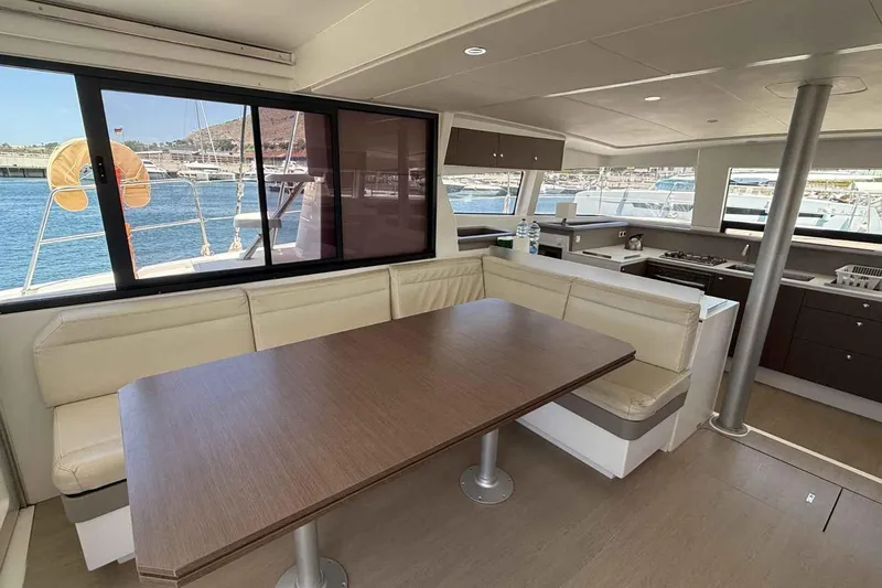 Raf IV Yacht Photos Pics Modern interior of 2020 Bali 4.3 catamaran with dining area and kitchen.