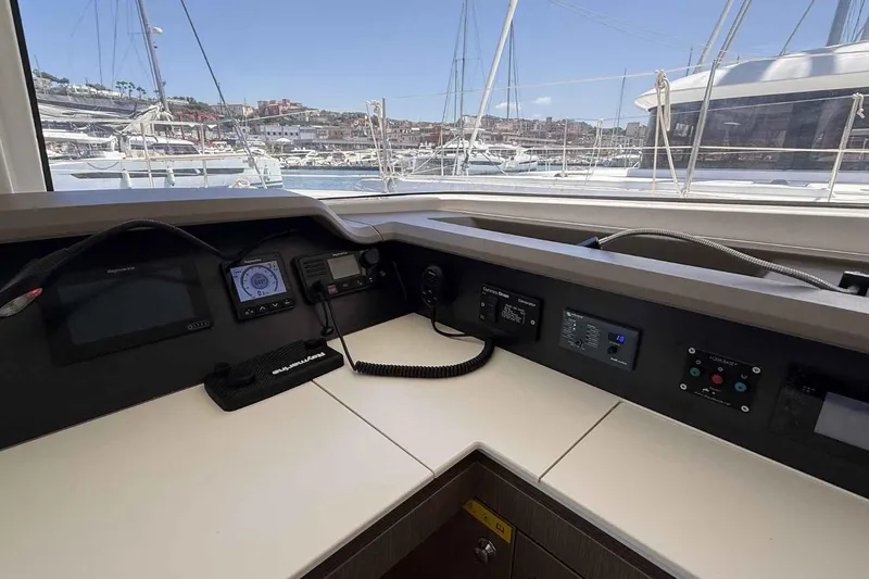 Raf IV Yacht Photos Pics Control panel of a 2020 Bali 4.3 catamaran with marina view in the background.