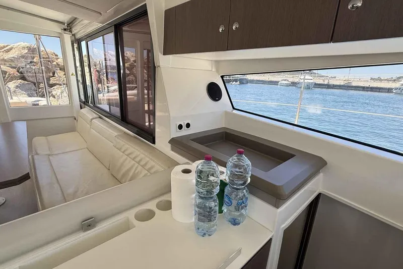 Raf IV Yacht Photos Pics Interior of 2020 Bali 4.3 catamaran with sofa, sink, and sea view.