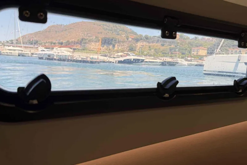 Raf IV Yacht Photos Pics View from Bali 4.3 yacht window, overlooking marina and hillside, 2020 model.