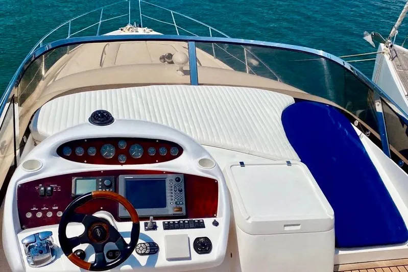  Yacht Photos Pics Cockpit view of 2004 Sunseeker Manhattan 56 yacht with steering wheel and navigation controls.