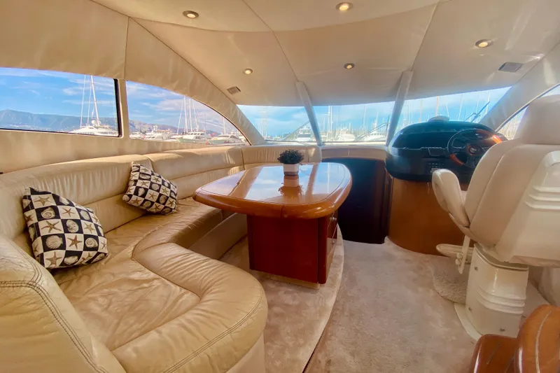  Yacht Photos Pics Luxurious interior of 2004 Sunseeker Manhattan 56 yacht with plush seating and elegant decor.
