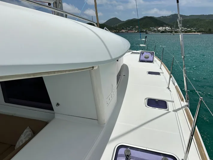  Yacht Photos Pics 2014 Lagoon 400 S2 catamaran deck with scenic ocean and mountain backdrop.