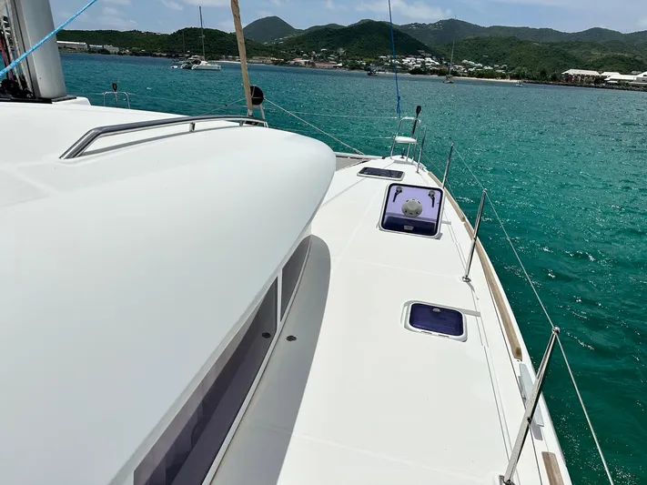  Yacht Photos Pics Lagoon 400 S2 catamaran sailing on turquoise waters, 2014 model.