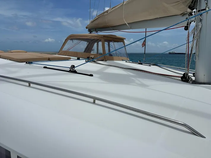 Yacht Photos Pics 2014 Lagoon 400 S2 catamaran deck with blue sky and ocean backdrop.