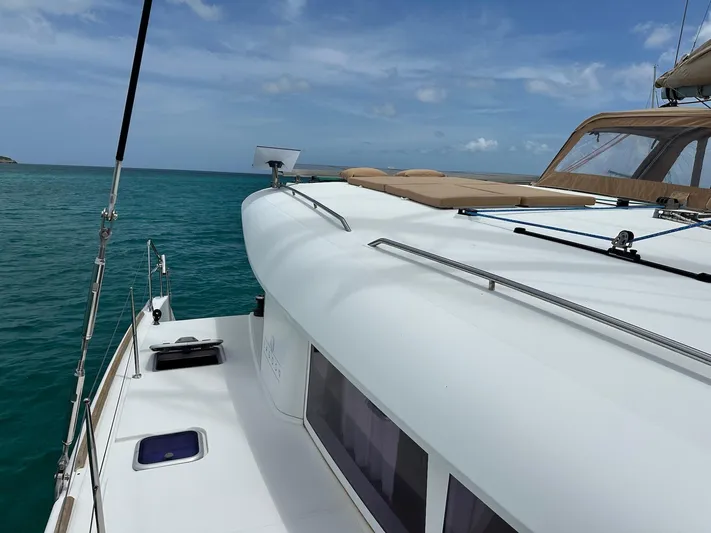  Yacht Photos Pics 2014 Lagoon 400 S2 catamaran on turquoise water under a clear blue sky.