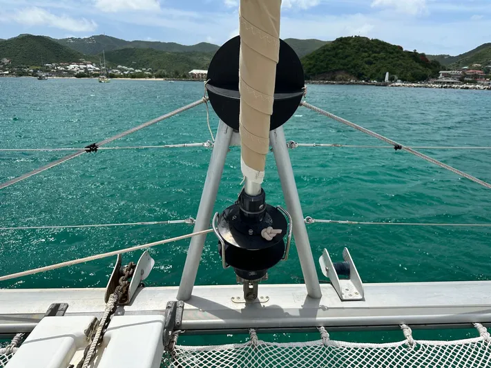  Yacht Photos Pics Front deck view of a 2014 Lagoon 400 S2 catamaran sailing in turquoise waters.