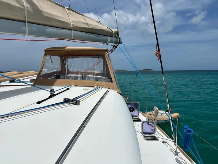  Yacht Photos Pics 2014 Lagoon 400 S2 catamaran sailing on turquoise waters under a clear sky.