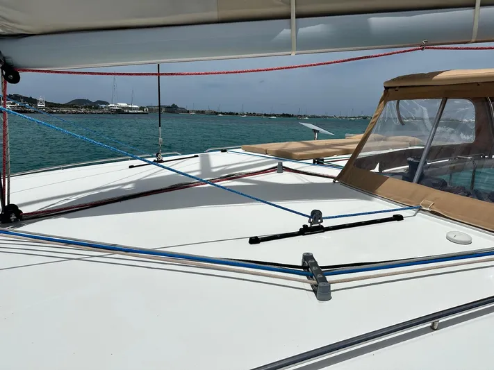  Yacht Photos Pics 2014 Lagoon 400 S2 catamaran deck with ropes and canopy, sailing on calm waters.