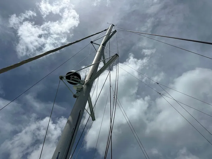 Yacht Photos Pics Mast of 2014 Lagoon 400 S2 sailboat against cloudy sky.
