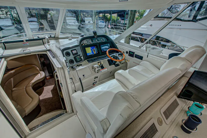 Bula Bula Yacht Photos Pics 2006 Sea Ray 40 Motor Yacht cockpit with plush seating and advanced navigation controls.