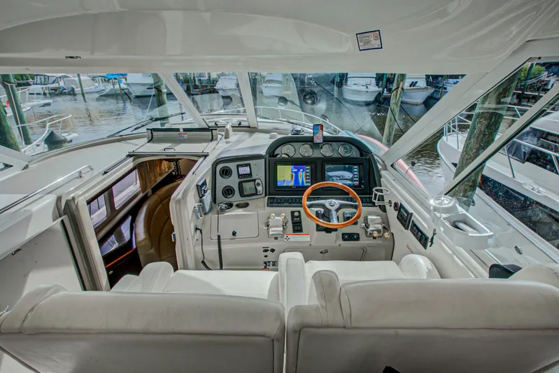 Bula Bula Yacht Photos Pics 2006 Sea Ray 40 Motor Yacht helm with modern navigation equipment and luxurious seating.