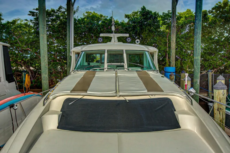 Bula Bula Yacht Photos Pics 2006 Sea Ray 40 Motor Yacht docked, front view with lush greenery background.