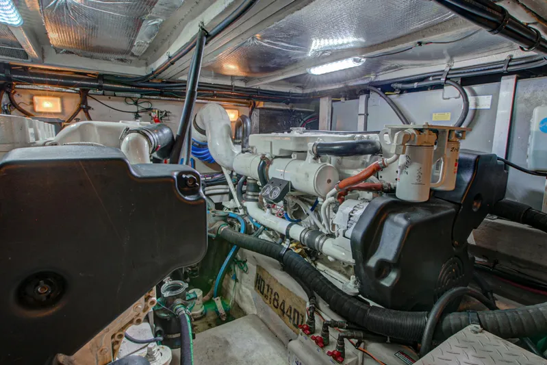 Bula Bula Yacht Photos Pics Engine room of a 2006 Sea Ray 40 Motor Yacht, showcasing mechanical components and wiring.