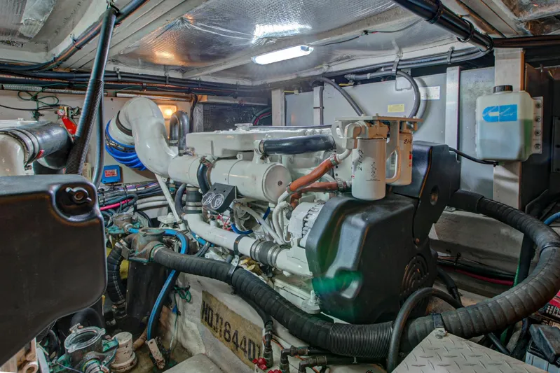 Bula Bula Yacht Photos Pics Engine room of a 2006 Sea Ray 40 Motor Yacht, showcasing mechanical components and wiring.