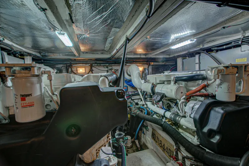 Bula Bula Yacht Photos Pics Engine room of a 2006 Sea Ray 40 Motor Yacht, showcasing mechanical components and piping.