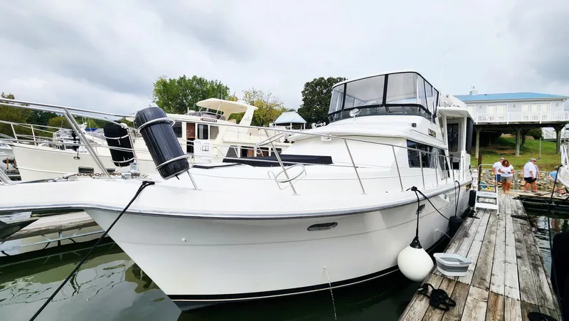 Now Or Never Yacht Photos Pics 1995 Carver 440 Aft Cabin Motor Yacht docked at marina.