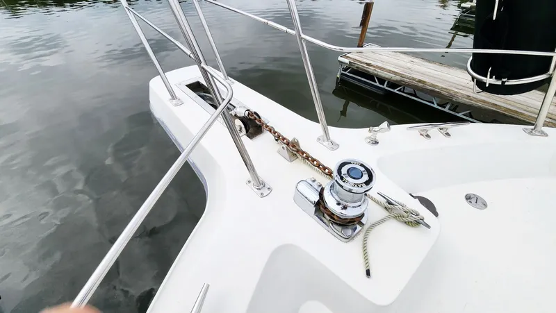 Now Or Never Yacht Photos Pics 1995 Carver 440 Aft Cabin Motor Yacht bow with anchor and winch system.