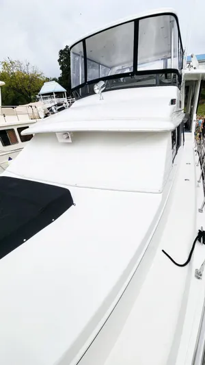 Now Or Never Yacht Photos Pics 1995 Carver 440 Aft Cabin Motor Yacht with sleek white exterior and spacious deck.