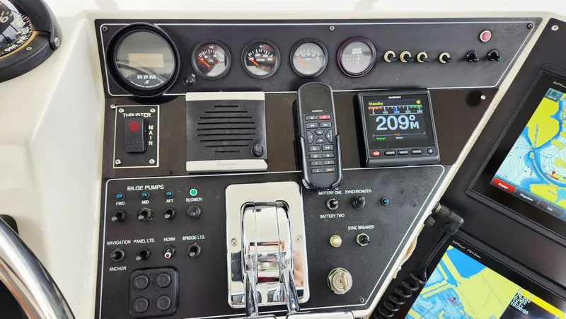 Now Or Never Yacht Photos Pics Control panel of a 1995 Carver 440 Aft Cabin Motor Yacht with navigation instruments.