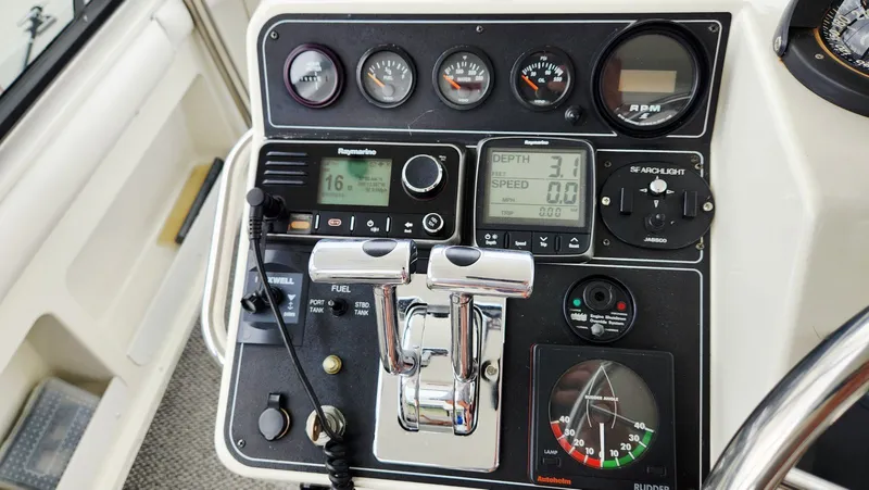 Now Or Never Yacht Photos Pics Control panel of a 1995 Carver 440 Aft Cabin Motor Yacht with gauges and navigation equipment.