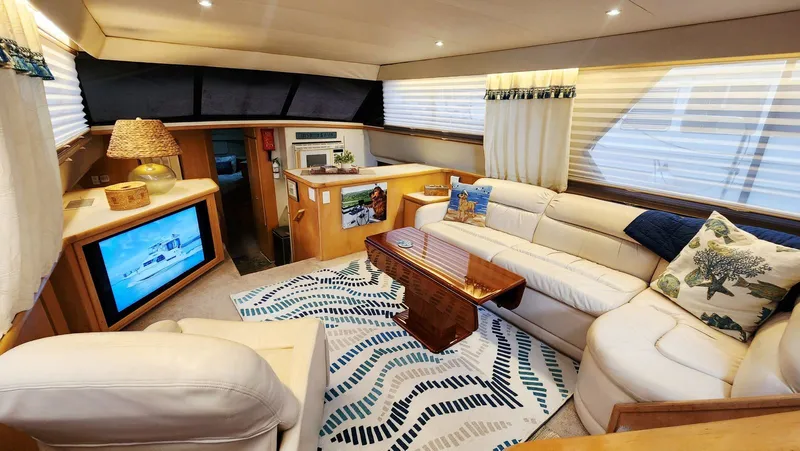 Now Or Never Yacht Photos Pics Luxurious interior of 1995 Carver 440 Aft Cabin Motor Yacht with plush seating and decor.