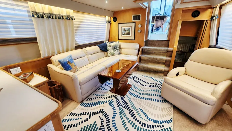 Now Or Never Yacht Photos Pics Luxurious 1995 Carver 440 Aft Cabin Motor Yacht interior with plush seating and elegant decor.