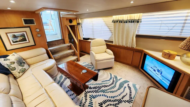 Now Or Never Yacht Photos Pics Luxurious interior of 1995 Carver 440 Aft Cabin Motor Yacht with plush seating and modern decor.