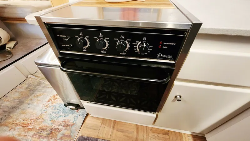 Now Or Never Yacht Photos Pics Stainless steel oven in 1995 Carver 440 Aft Cabin Motor Yacht kitchen.