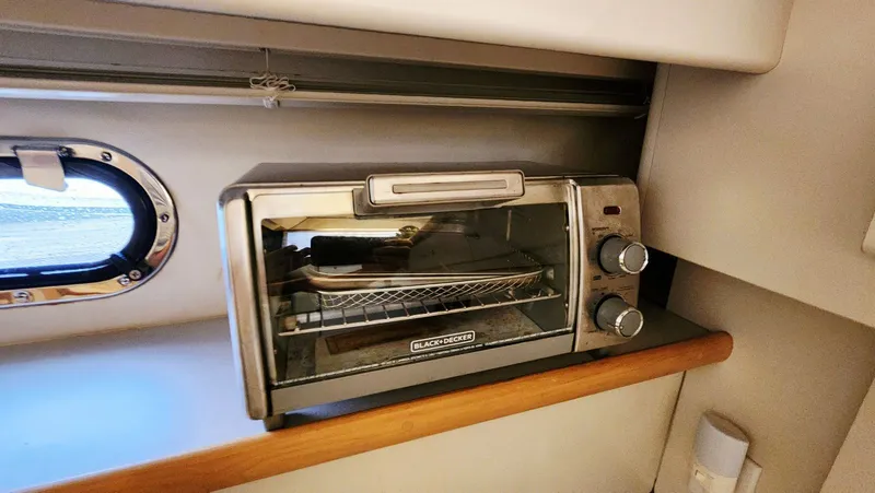 Now Or Never Yacht Photos Pics Toaster oven inside 1995 Carver 440 Aft Cabin Motor Yacht kitchen area.