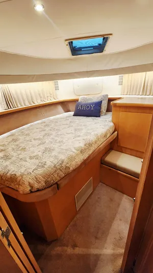 Now Or Never Yacht Photos Pics 1995 Carver 440 Aft Cabin Motor Yacht bedroom with cozy bed and "Ahoy" pillow.