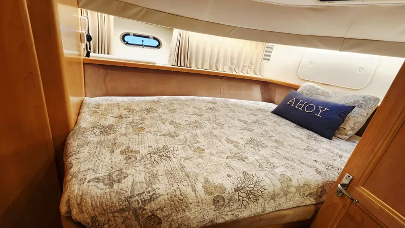 Now Or Never Yacht Photos Pics Cozy bedroom in 1995 Carver 440 Aft Cabin Motor Yacht with nautical decor.