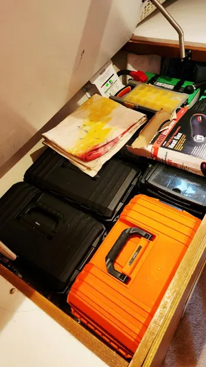 Now Or Never Yacht Photos Pics Storage compartment with toolboxes and supplies on a 1995 Carver 440 Aft Cabin Motor Yacht.