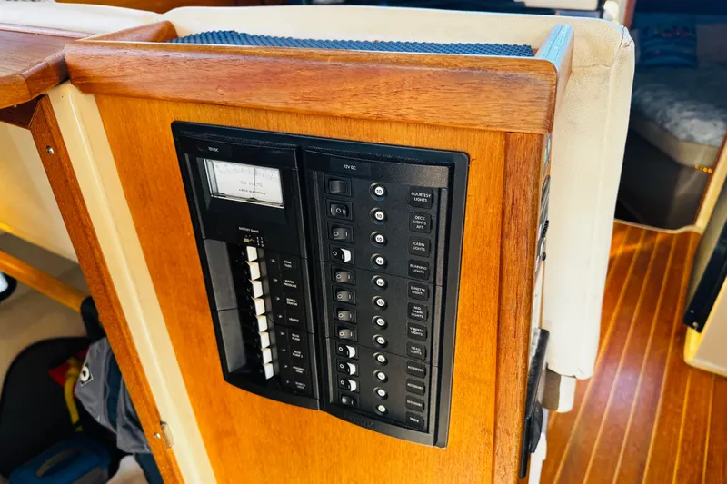 Walrus Yacht Photos Pics Electrical panel on 2012 Ranger Tugs R-31 boat with wooden interior.