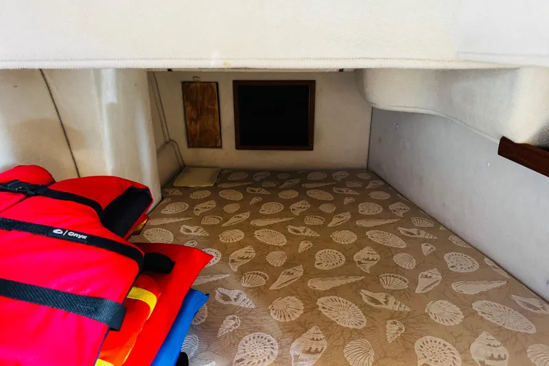 Walrus Yacht Photos Pics Interior cabin of 2012 Ranger Tugs R-31 with patterned flooring and life jackets.