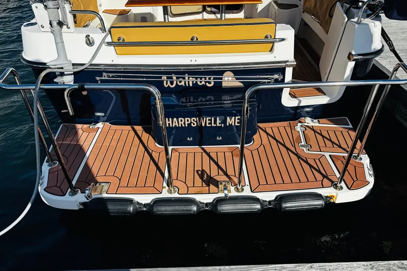 Walrus Yacht Photos Pics 2012 Ranger Tugs R-31 boat stern with wooden deck, docked in Harpswell, ME.