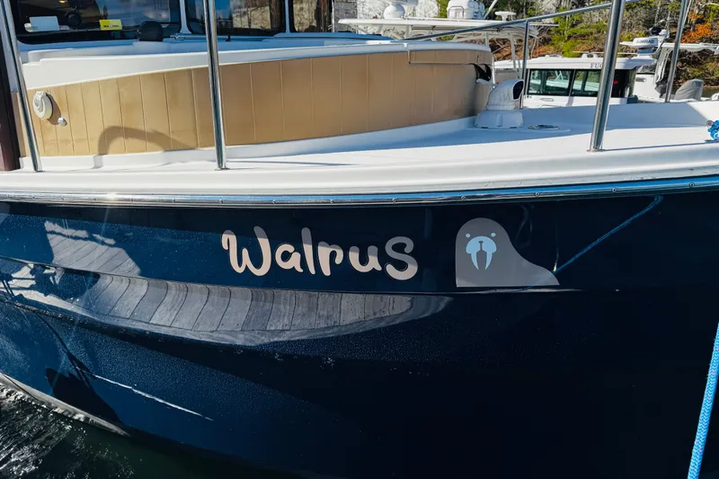Walrus Yacht Photos Pics 2012 Ranger Tugs R-31 boat named "Walrus" with walrus graphic on the hull.