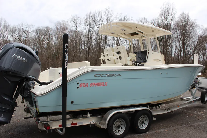  Yacht Photos Pics 2022 Cobia 280 Center Console boat on trailer with Yamaha engine.